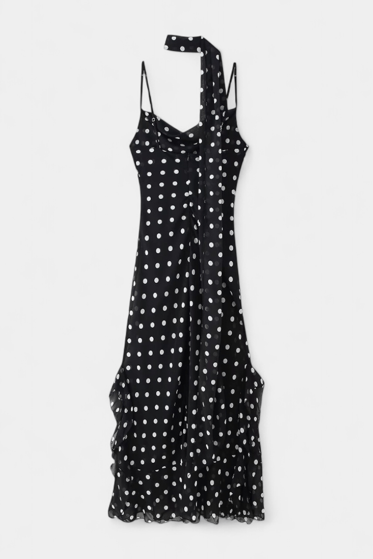Lightweight women's polka dot party dress with adjustable straps, offering a romantic and elegant summer style.