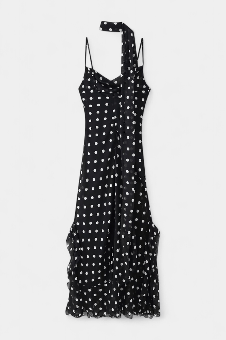 Lightweight women's polka dot party dress with adjustable straps, offering a romantic and elegant summer style.