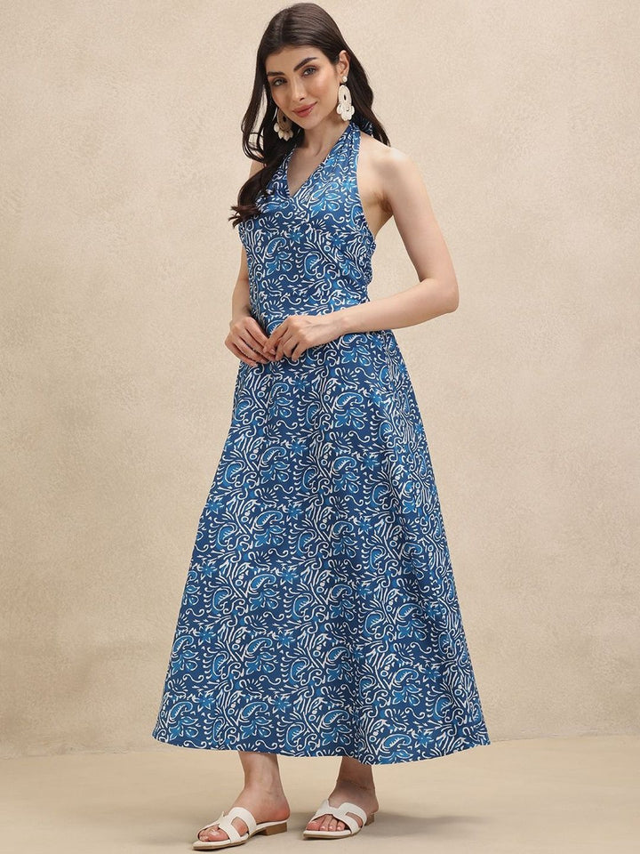 Women's elegant blue floral halterneck maxi dress, perfect for summer vacation or a beach party.