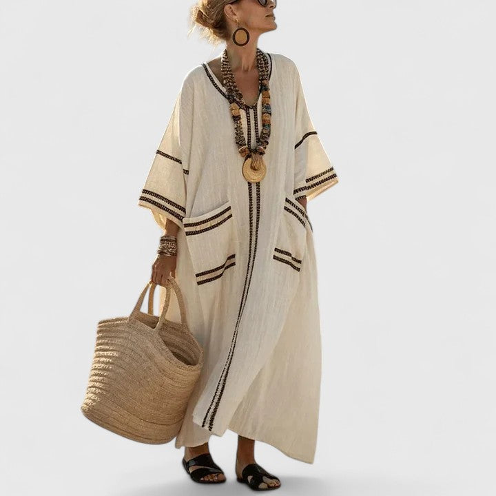 Women's elegant bohemian maxi dress with V-neck, relaxed fit, perfect for summer vacations. Flowy & comfortable.