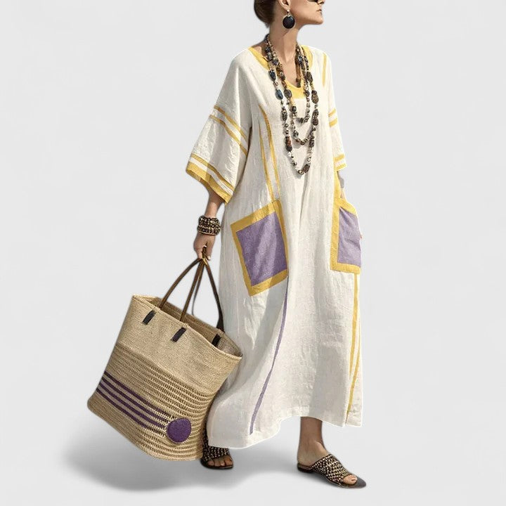 Women's elegant bohemian maxi dress with pockets, V-neck, flowy relaxed fit. Great for summer casual & vacation.