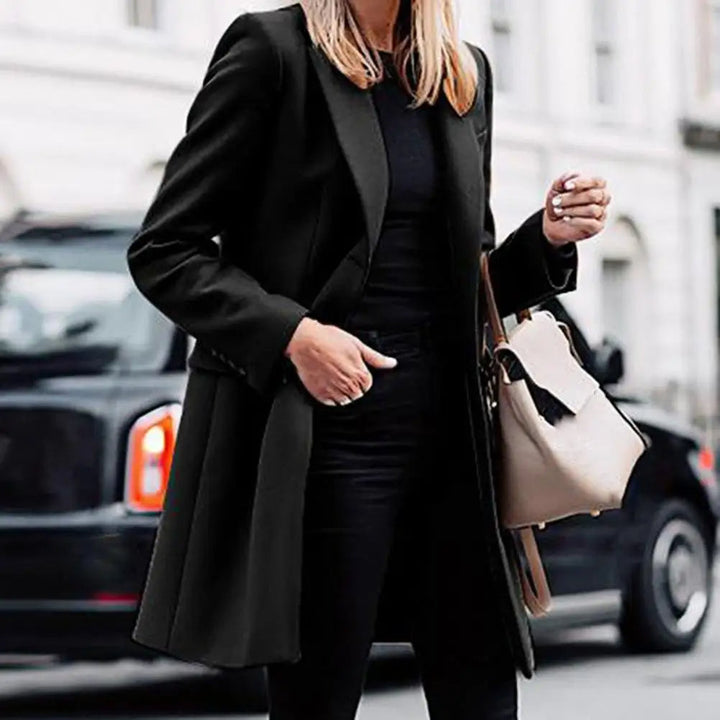 Close-up of the double-breasted buttons on a stylish women's bohemian trench coat, ideal for winter fashion.