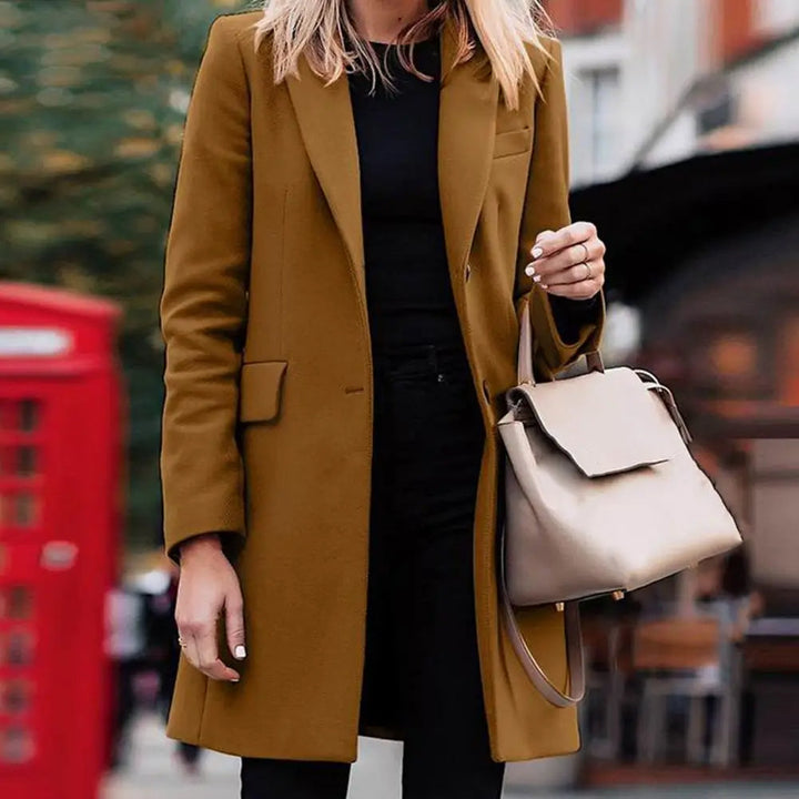 Back view of a new women's elegant bohemian winter trench coat, a fashionable and seasonal outerwear jacket.
