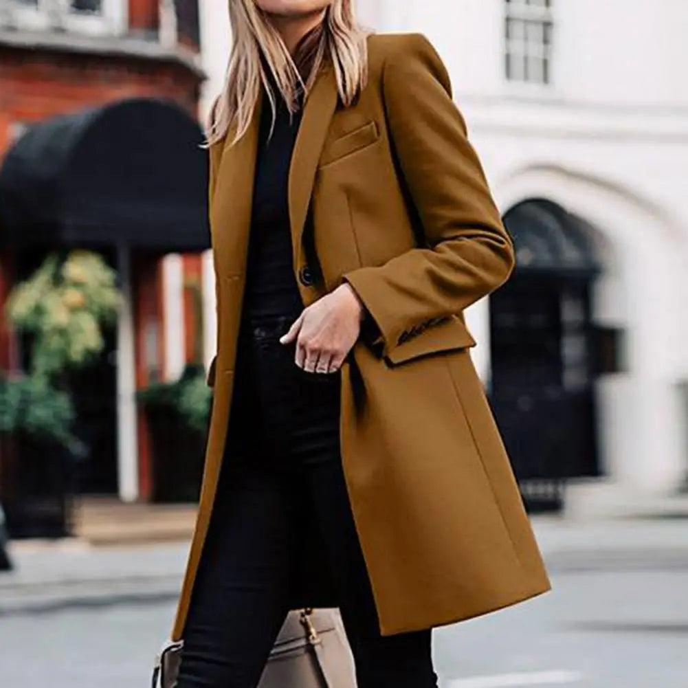 Side view of a flowy women's bohemian trench coat, an elegant winter fashion outerwear piece for stylish women.