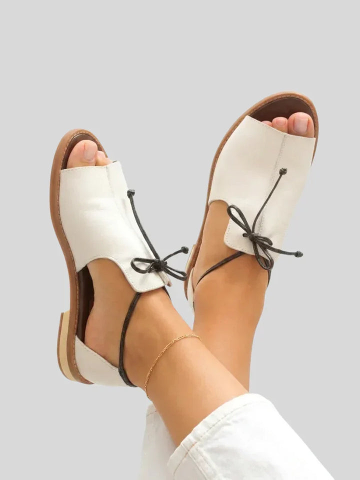 Women's fashion bow-tie strap sandals, comfortable and chic for any casual or elegant summer look.