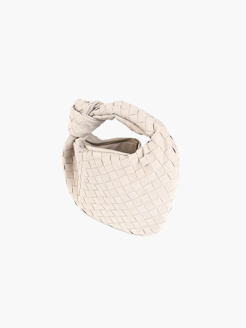 Stylish women's suede mini bag with intricate braided design.