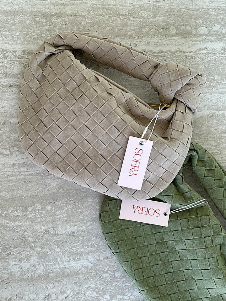 Fashionable compact suede mini bag with braided design for women.