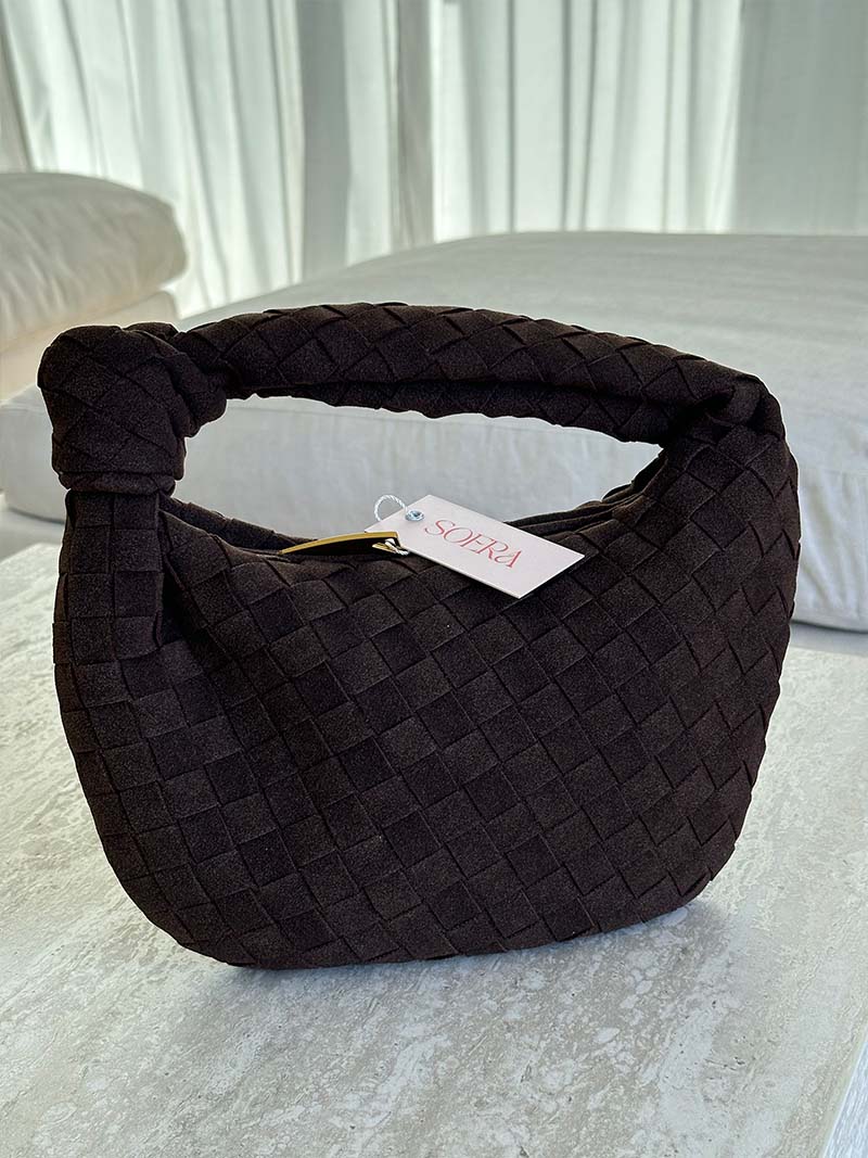 Women's braided suede mini handbag, a stylish and compact accessory.