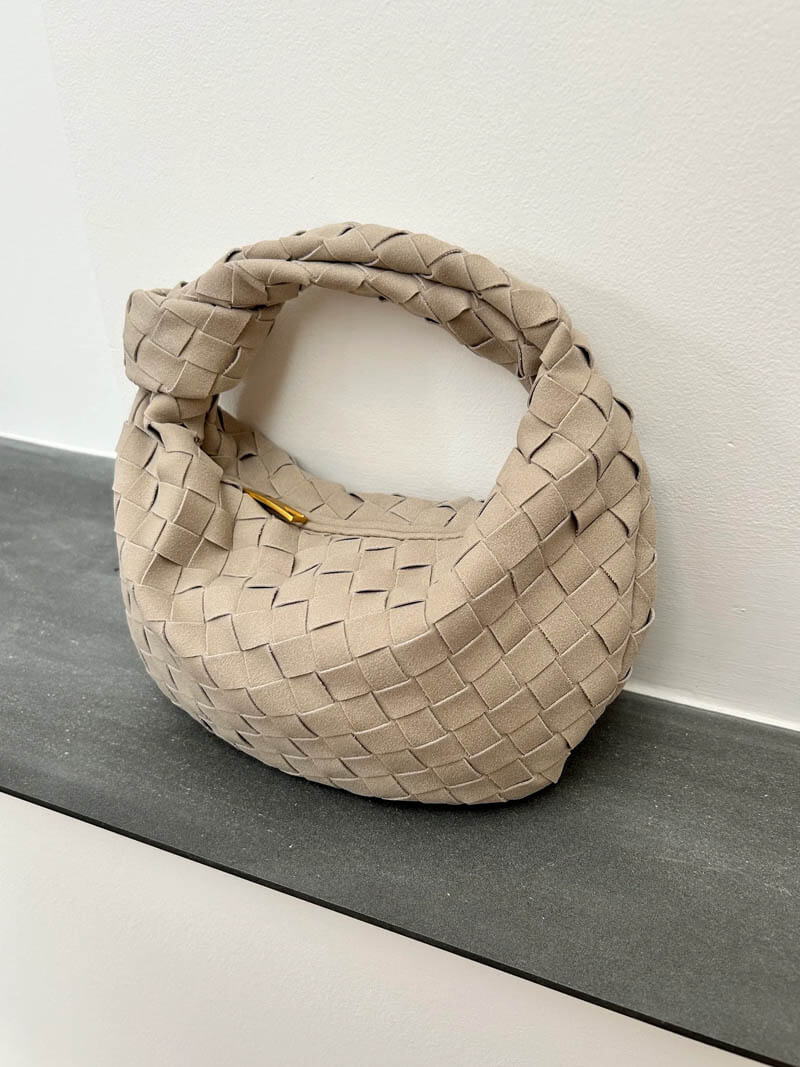 Fashionable braided suede mini bag, a must-have compact accessory.