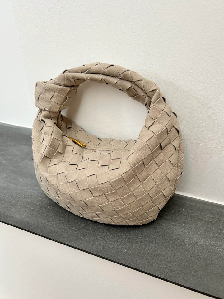 Fashionable braided suede mini bag, a must-have compact accessory.