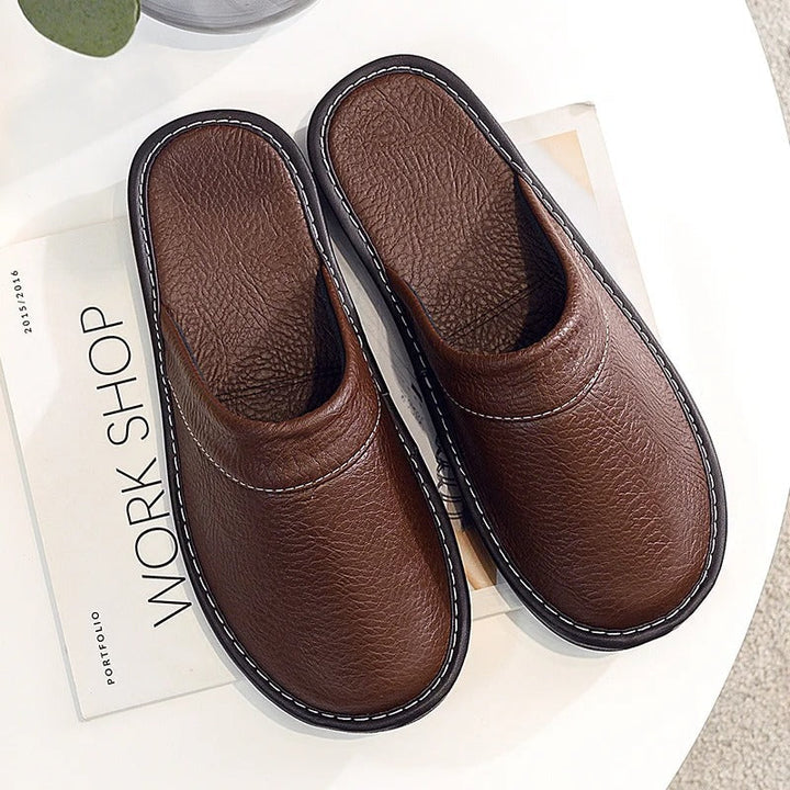 Chic leather slippers for women, offering a cozy and elegant home experience.