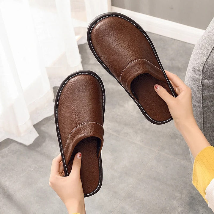 Cozy womens slippers in rich brown leather, perfect for comfortable home wear.