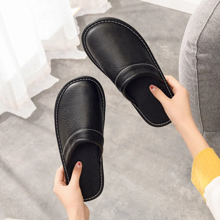 Soft, comfortable leather slippers designed for women's home wear.