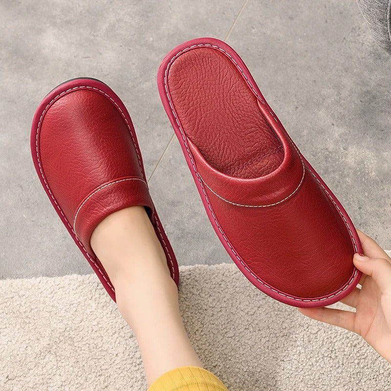 Stylish slip-on leather slippers for women, blending comfort with elegance.