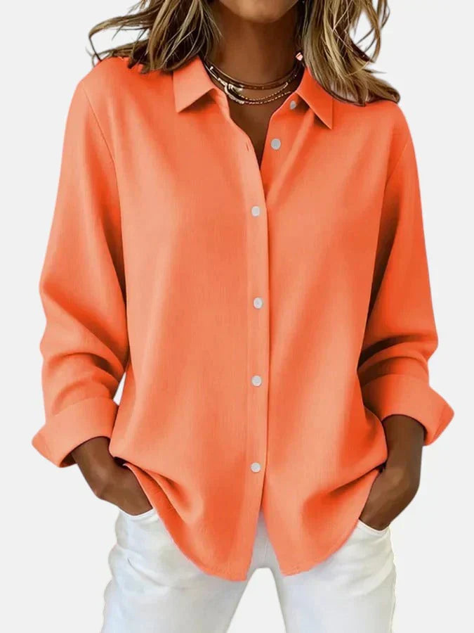 Stylish women's blouse with elegant button collar. Versatile fashion, ideal for office or casual chic outfits.