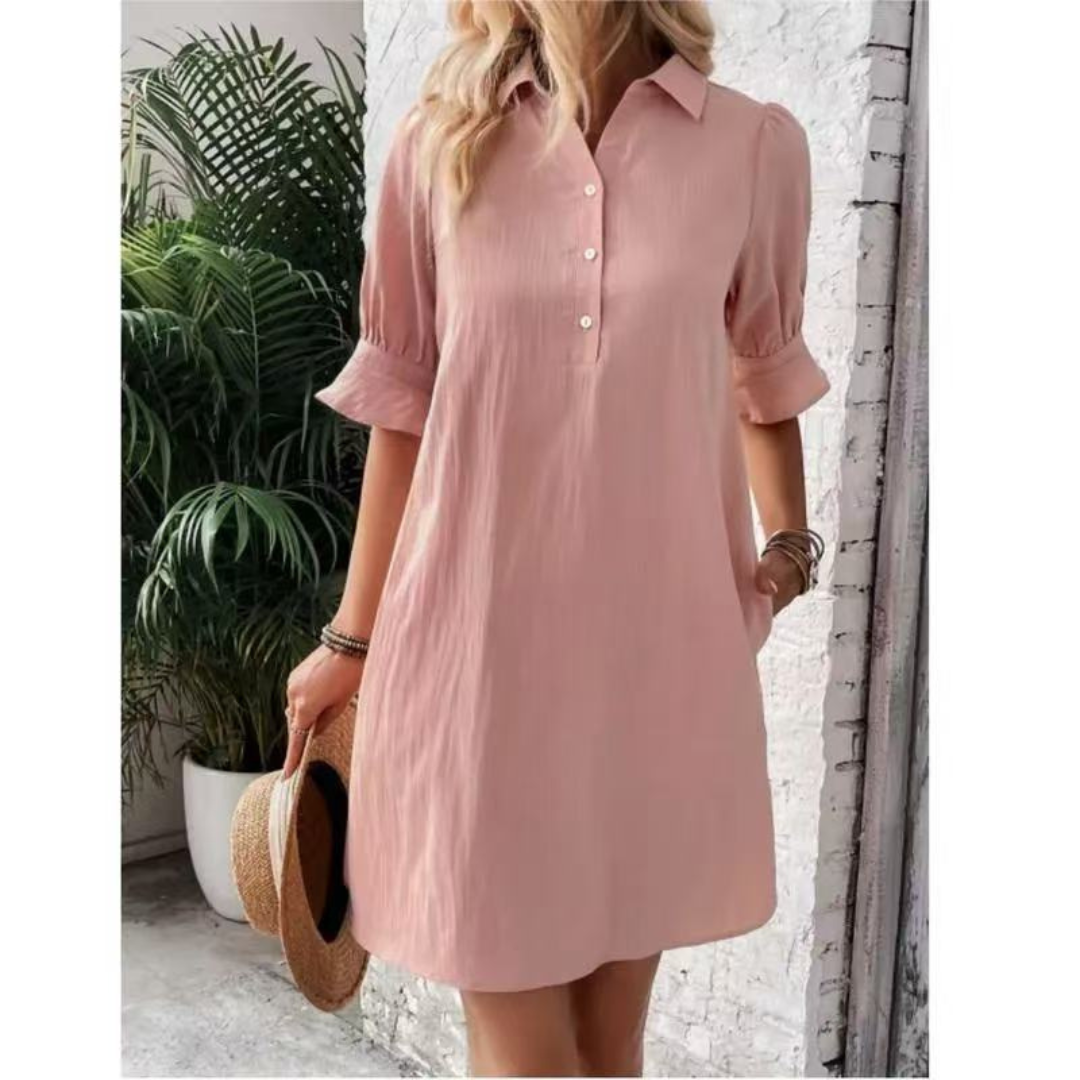 Relaxed fit women's button-down shirt dress with elegant collar, perfect for day or summer wear.