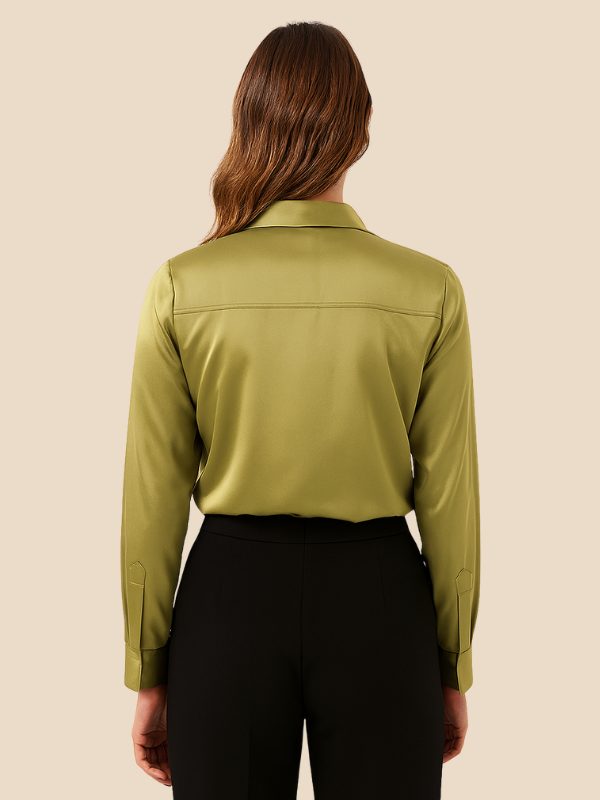 Women's long sleeve button-down shirt, pointed collar, detail of cuffs & buttons.