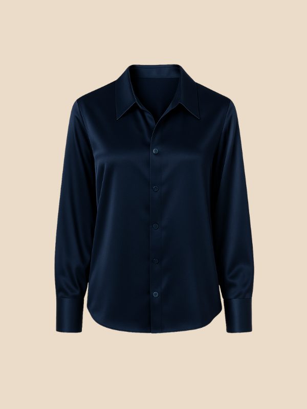 Professional women's button-down shirt, long sleeve, pointed collar, neutral shade.