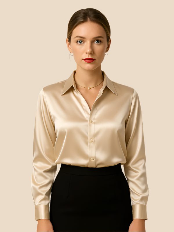Versatile white women's button-down shirt, long sleeve, pointed collar, paired with a skirt.