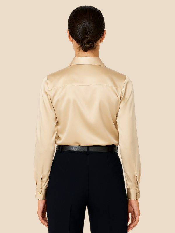 Women's elegant button-down top, long sleeve, pointed collar, in a vibrant color.