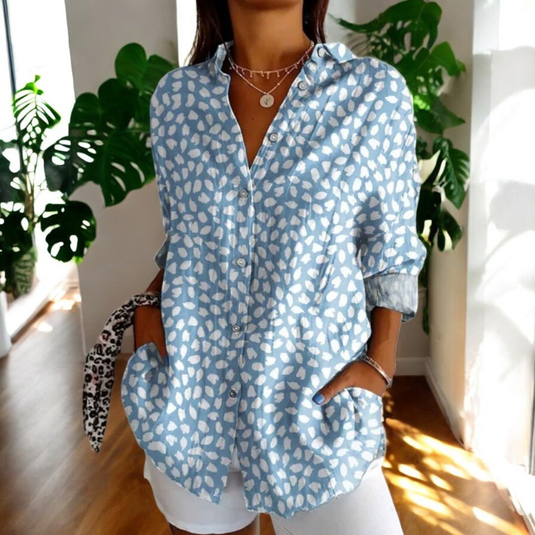 Women's long sleeve button-front blouse. Elegant everyday top with classic buttons, versatile for chic fashion.