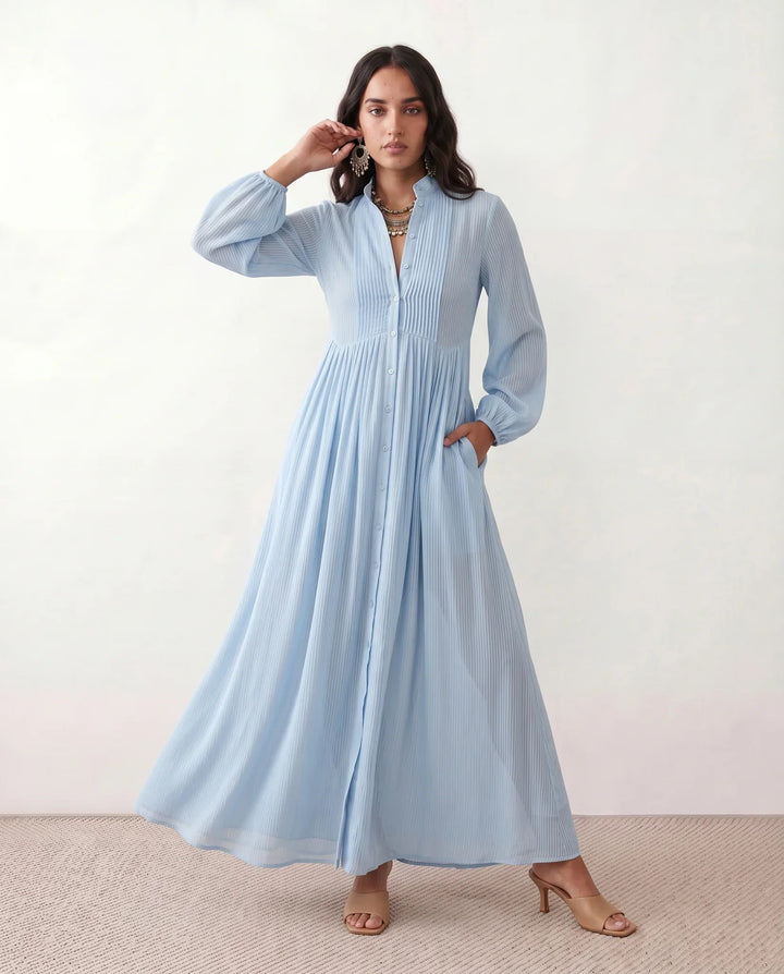 Close-up of a stylish button-front detail on a women's elegant summer maxi sundress.