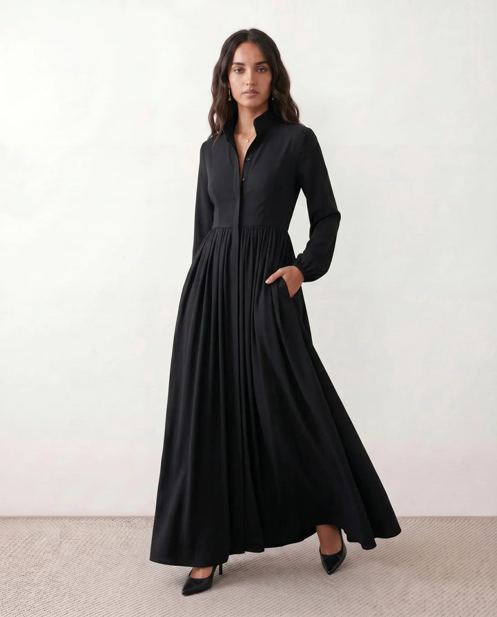 Elegant women's flowy maxi dress, perfect as a summer sundress or casual vacation outfit. Features button front.