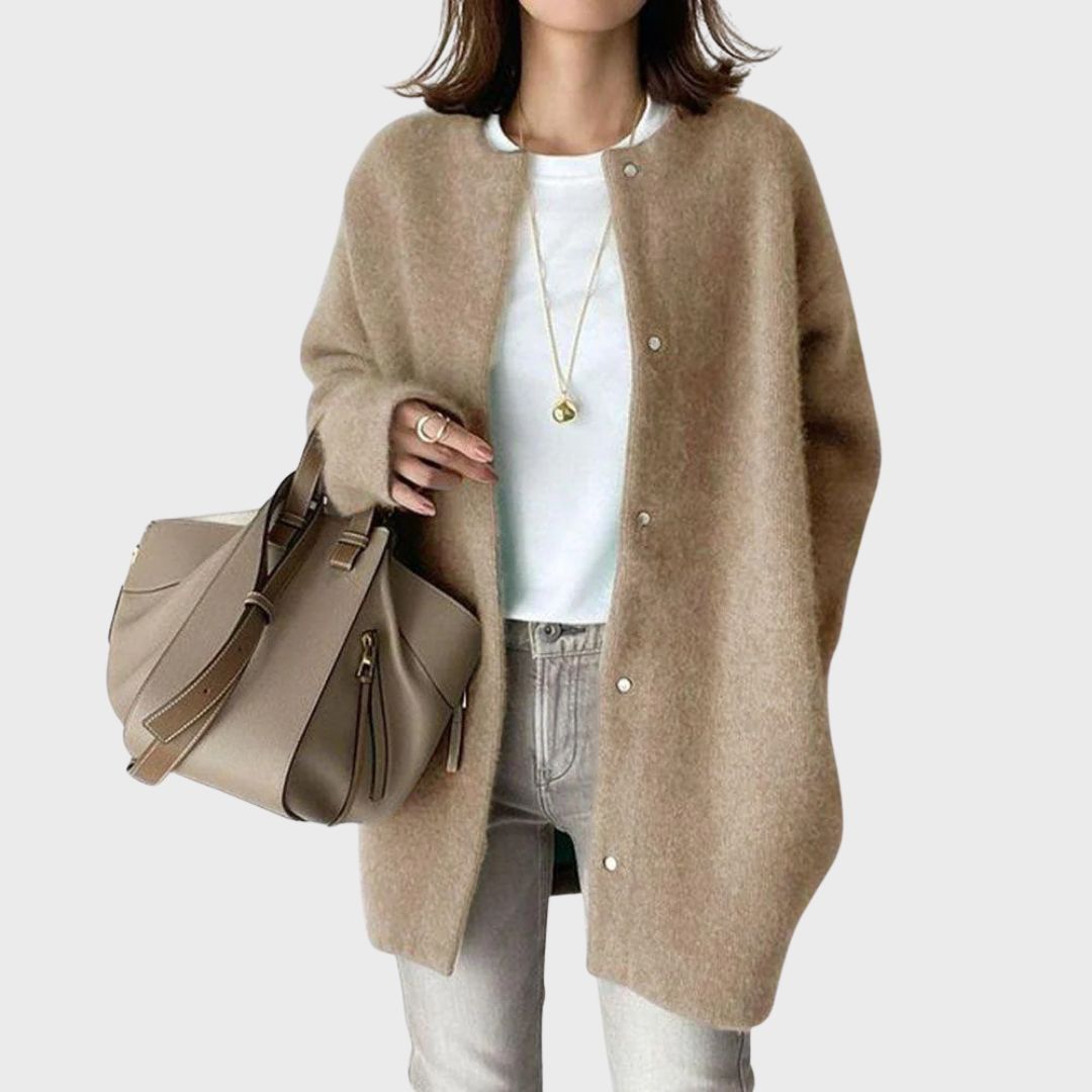 Women's elegant cashmere cardigan in cream, perfect for versatile layering.