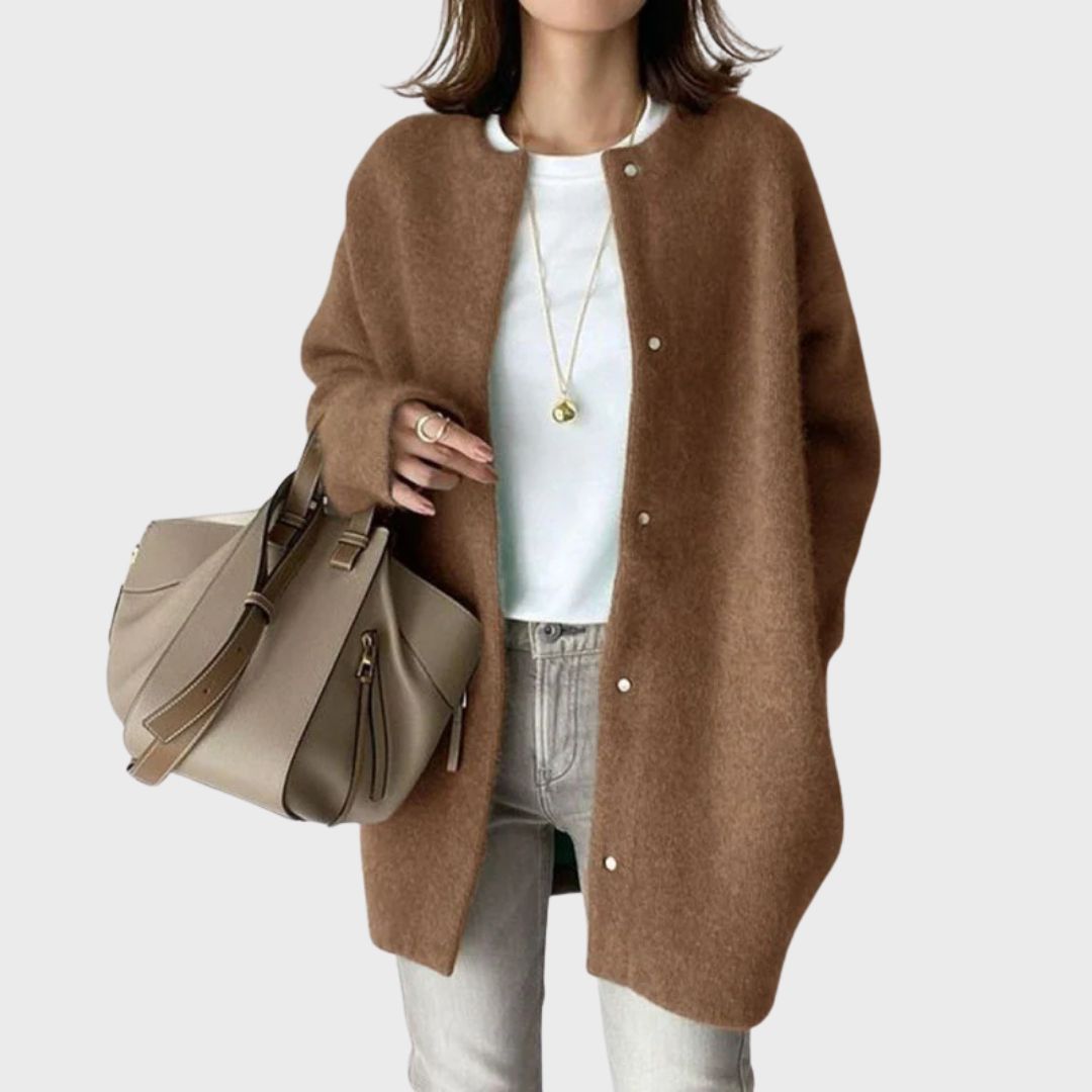 Women's fashion: Model wearing a stylish, versatile cream cashmere cardigan.