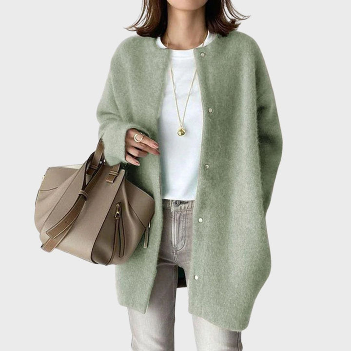 Timeless style: Olivia Ashford women's elegant cashmere cardigan in soft grey.