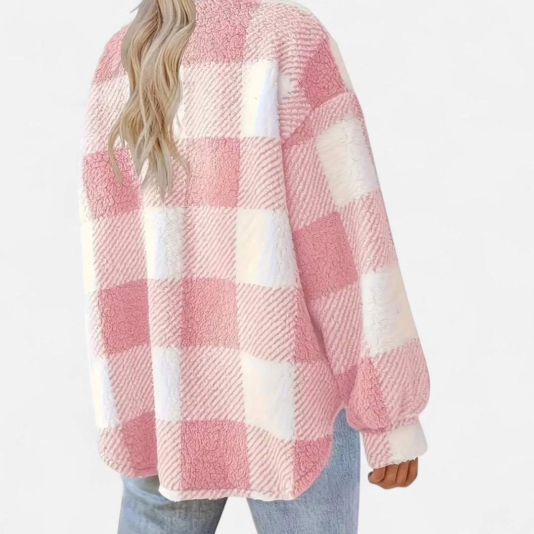 Close-up of the checkered print on this cozy and elegant women's jacket.