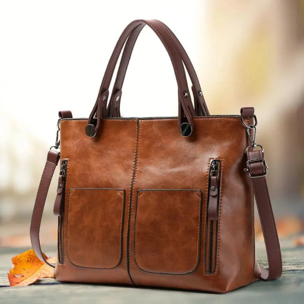 Women's elegant classic leather shoulder bag in black, a stylish and structured handbag.