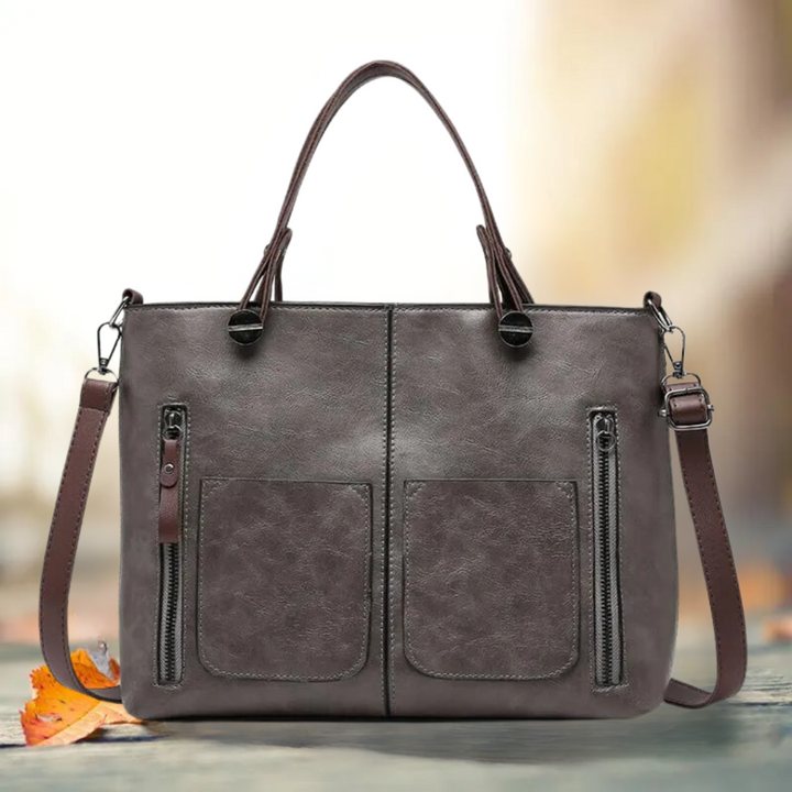 Versatile women's classic leather shoulder bag, an organized and stylish work bag accessory.