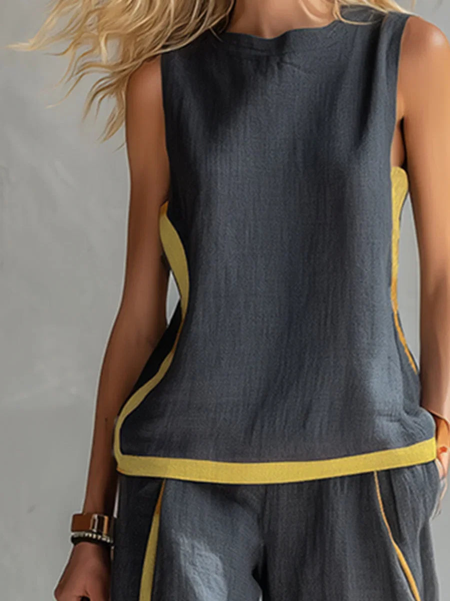 Comfortable two-piece women's set: contrast-trim sleeveless top & wide-leg pants. Versatile summer fashion.