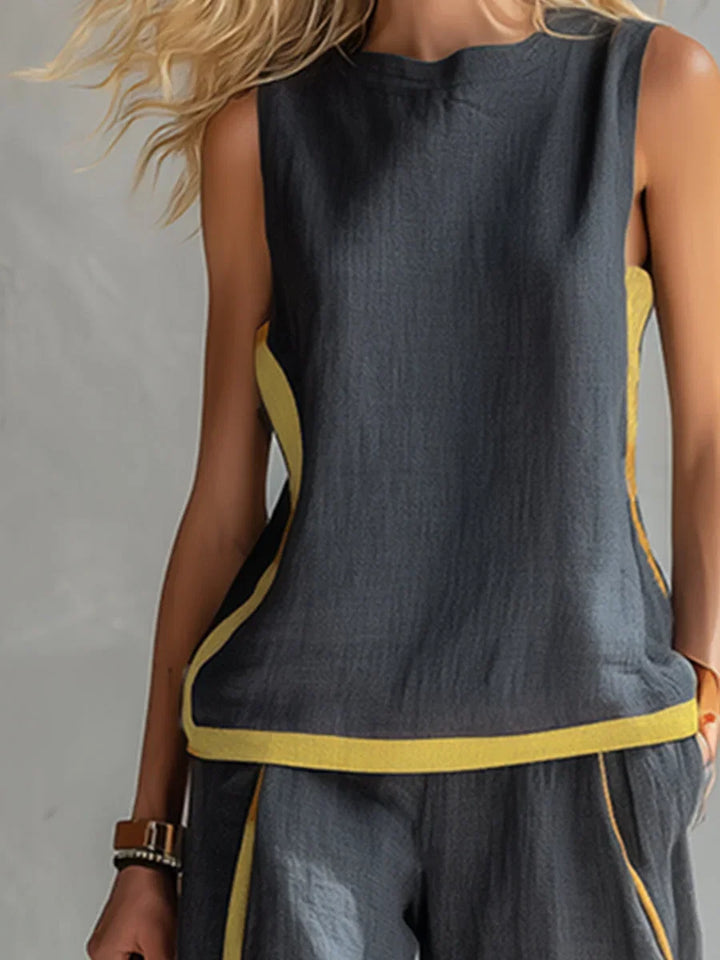 Comfortable two-piece women's set: contrast-trim sleeveless top & wide-leg pants. Versatile summer fashion.