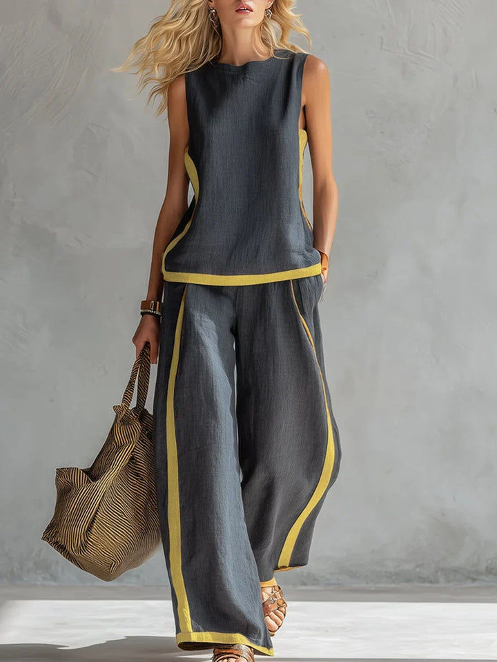 Stylish women's sleeveless top and wide-leg pants set with contrast trim. Ideal for casual wear or lounging.