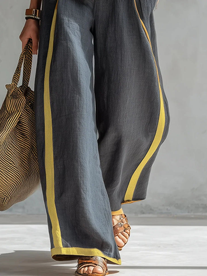 Women's versatile two-piece outfit: contrast-trim sleeveless top & flowy wide-leg pants. Summer casual fashion.