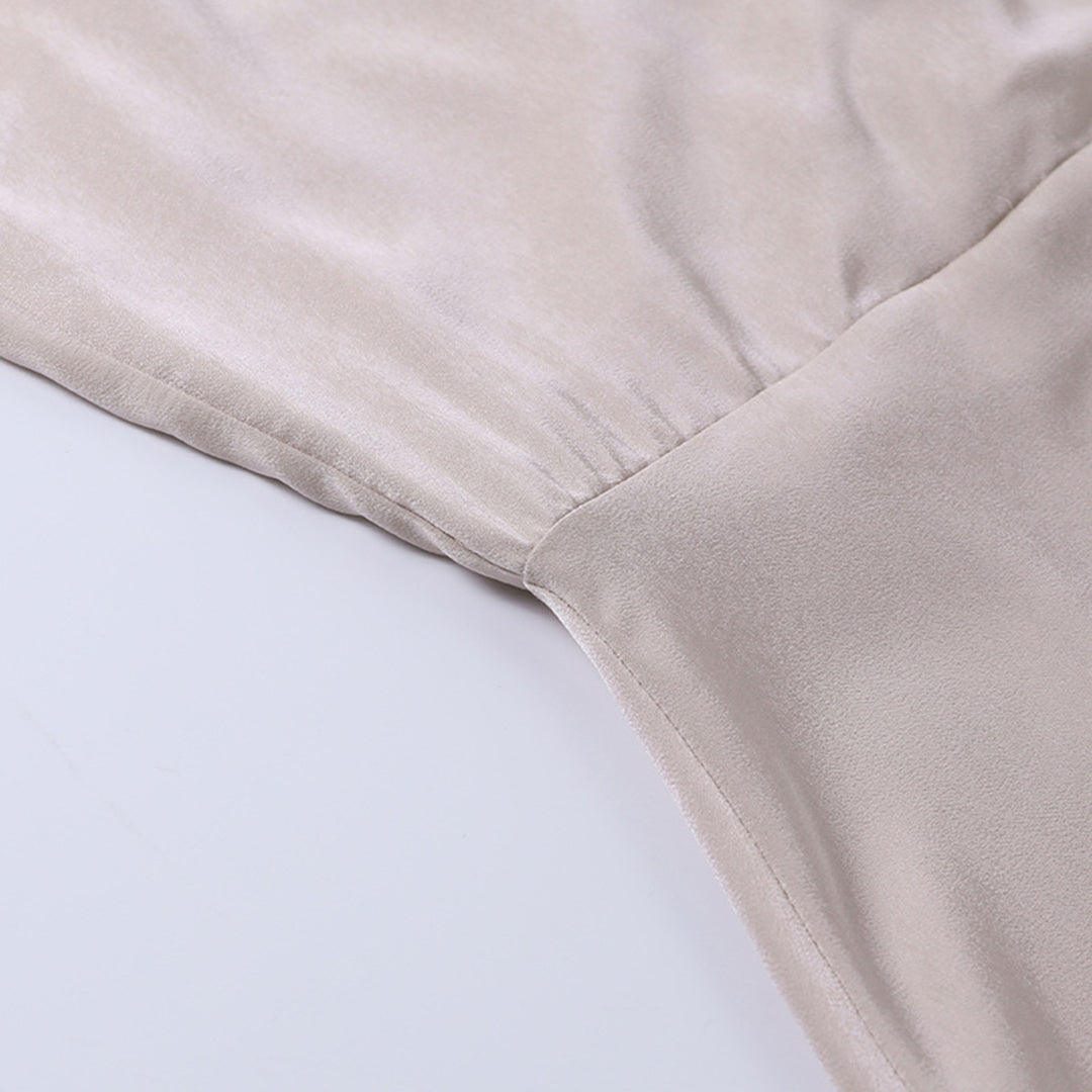 Beautifully draped women's midi dress with a sophisticated cowl V-neck, occasion wear.