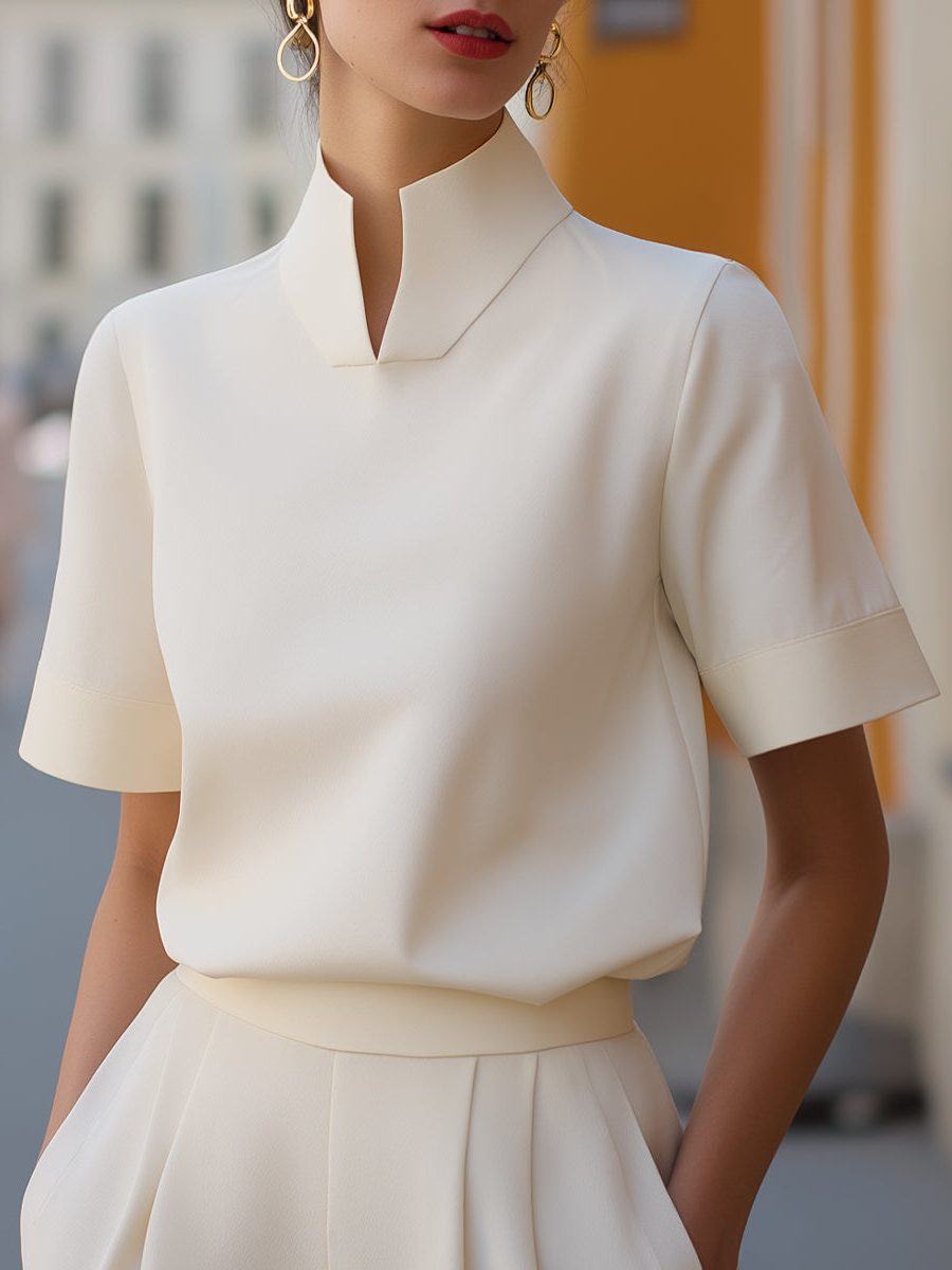 Women's elegant cropped blouse with a stylish stand collar and short sleeves, perfect for office or casual chic.