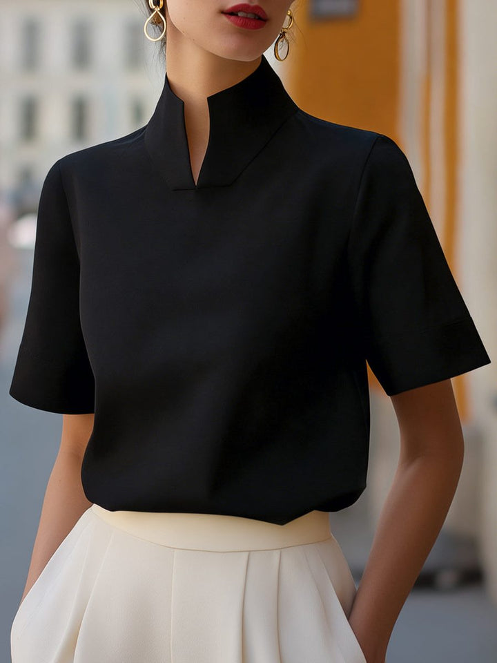 Versatile women's short sleeve cropped blouse with a chic stand collar, suitable for office, casual, or elegant looks.