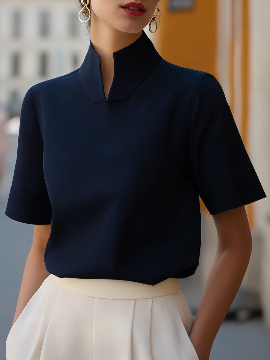 Cropped blouse for women, designed with a sleek stand collar and short sleeves for a sophisticated modern style.