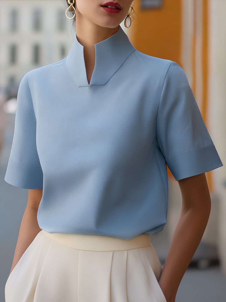Stylish women's workwear blouse: cropped fit, elegant stand collar, and comfortable short sleeves.