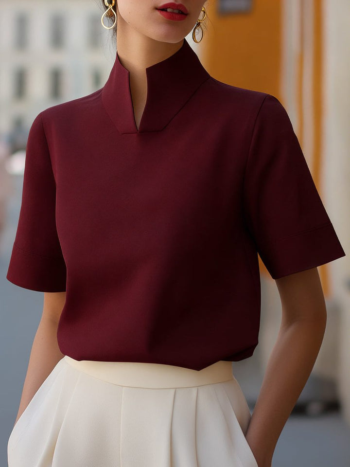 Casual chic women's cropped top with stand collar, short sleeves; a versatile and modern addition to any wardrobe.