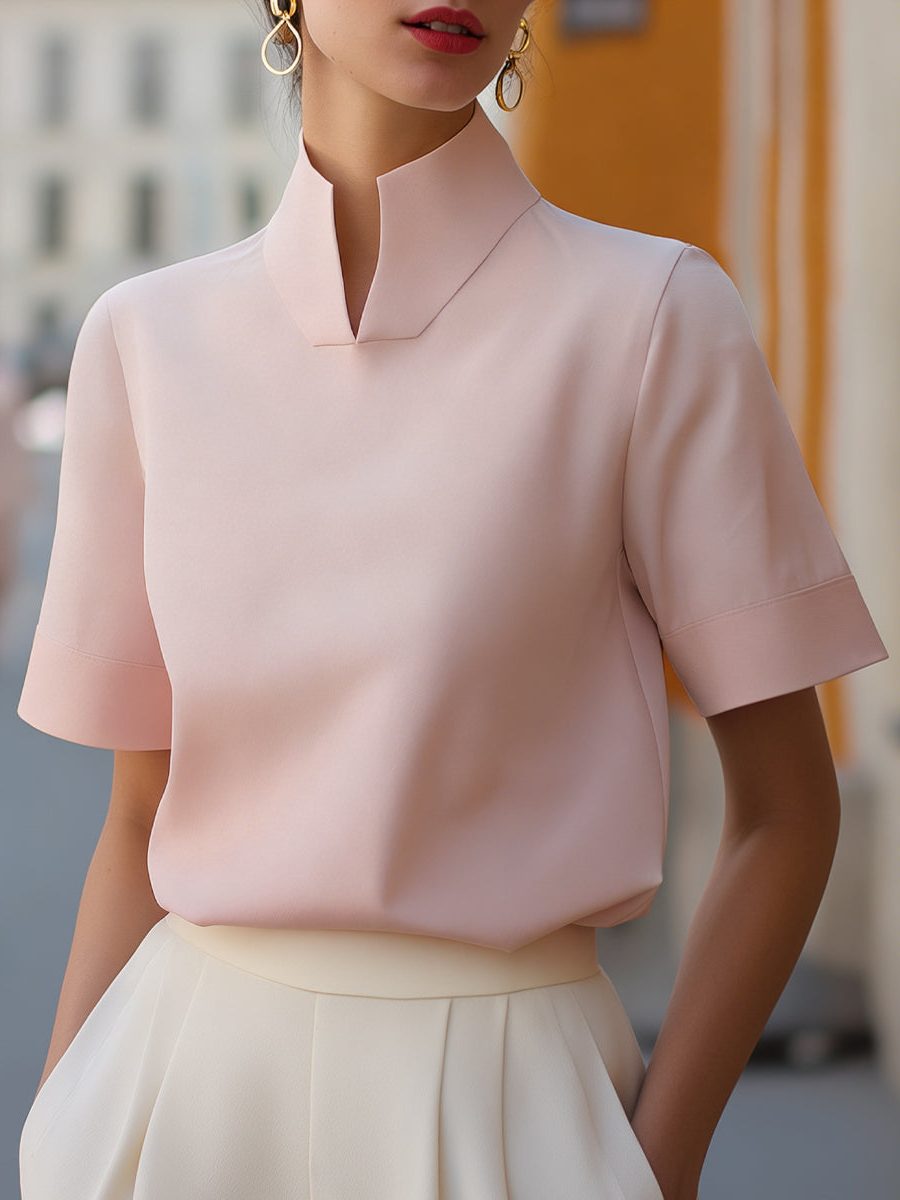 Sophisticated short sleeve cropped blouse for women with a distinctive stand collar, great for summer workwear.