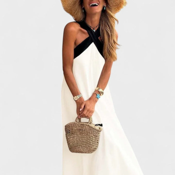 Versatile women's elegant cross-neck sleeveless maxi dress, great for both casual and formal wear.