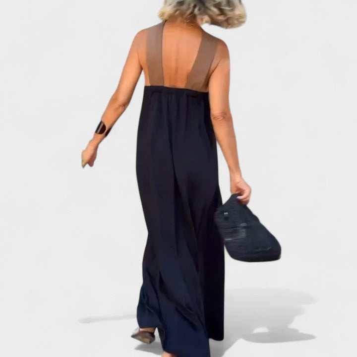 Flowy women's sleeveless maxi dress with an elegant cross-neck, perfect for comfort & style.