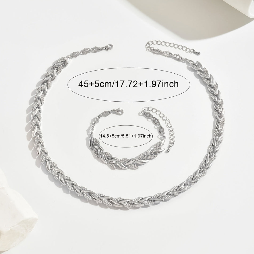 Women's exquisite crystal leaf necklace and bracelet jewelry set. Elegant design with sparkling crystals.