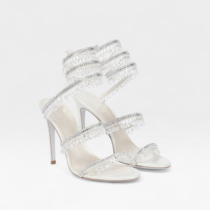 Sparkling crystal detail on elegant women's strappy high heel sandals for parties.