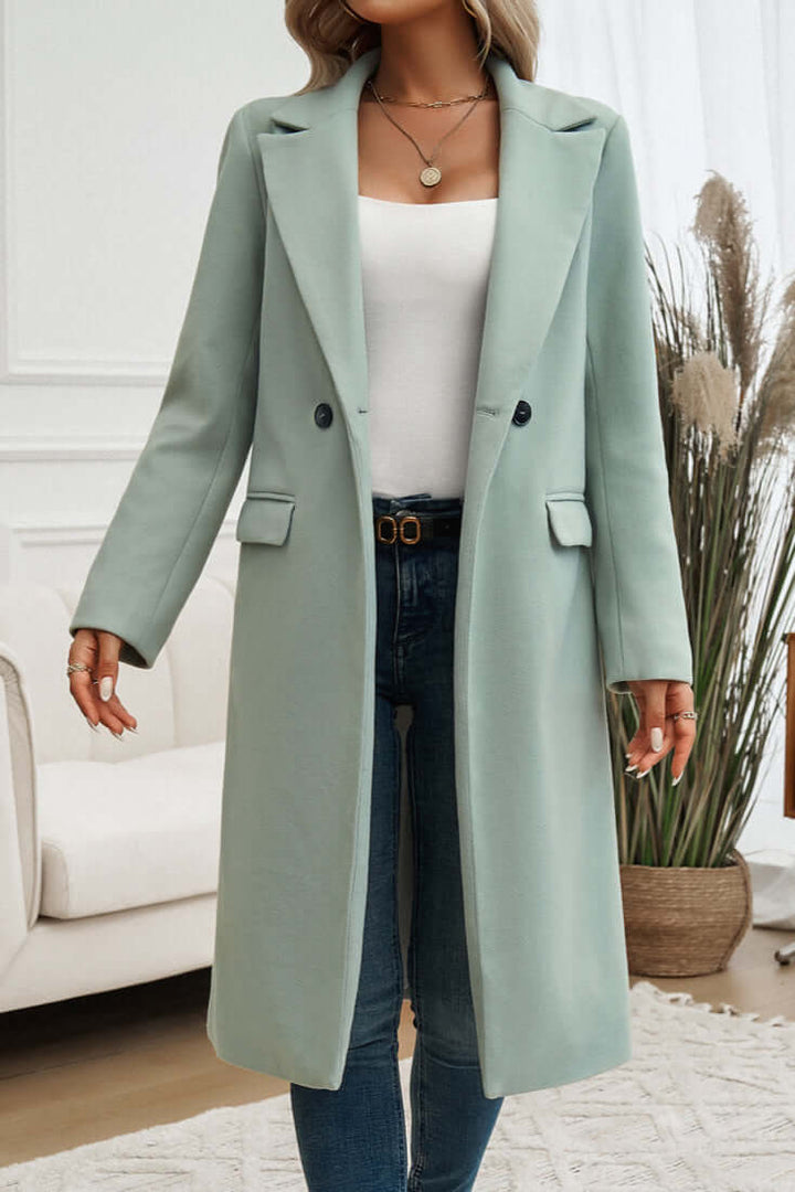 Sophisticated women's long coat, double-breasted design, ideal for formal or everyday wear.
