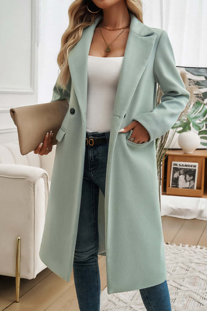 Warm women's double-breasted long coat, perfect for a chic and cozy winter look.